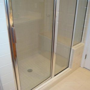 Shower before: has built-in seat/bench; total area 40" x 60"