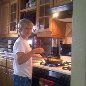 My Nephew Big Jon cooking me breakfast after spending the night at my house