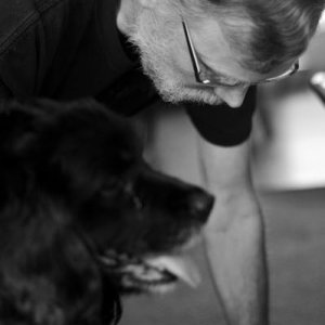 Dad playing with his dog Tuxedo