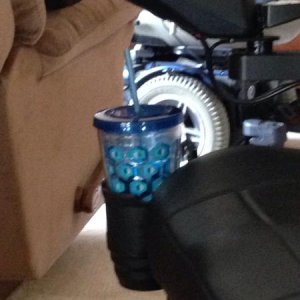 Cup holder - I bought the holder off Amazon.  Then my son made a bracket for it to mount on my old chair. When this one came my husband just unhooked 