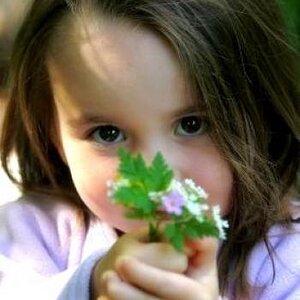 PHOTO GIRL GIVING FLOWERS.jpg